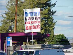 An anti-Mormon protester expresses his views at the Church's 2003 Mesa Easter Pageant.  Most anti-Mormon writers do not reach this level of vitriol, though some do.