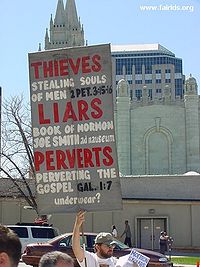 An anti-Mormon protester at April 2004 LDS General Conference criticizes the LDS use of the temple garment.