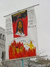 A protester at the April 2003 LDS General Conference attempts to convince others that members of the Church do not believe in the Biblical Jesus.  Members of the Church may believe some different things about Jesus, but this does not mean they worship a different being than the protester.